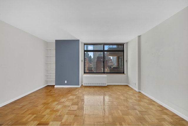 400 E 70th St Unit 1208, New York City, NY 10021 - empty room featuring radiator and baseboards