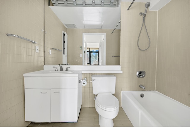 400 E 70th St Unit 1208, New York City, NY 10021 - full bath featuring tile walls, tile patterned flooring, shower / washtub combination, and vanity