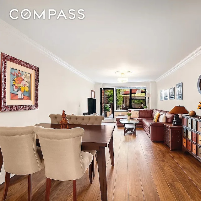 301 E 62nd St Unit 2K, New York City, NY 10065 - dining space with crown molding and hardwood / wood-style flooring