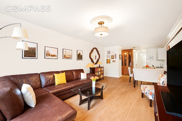 301 E 62nd St Unit 2K, New York City, NY 10065 - living area featuring crown molding and light wood-style floors
