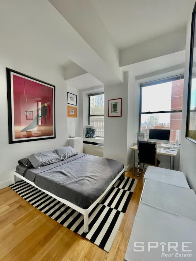 99 John St Unit 2201, New York City, NY 10038 - bedroom with wood finished floors and baseboards