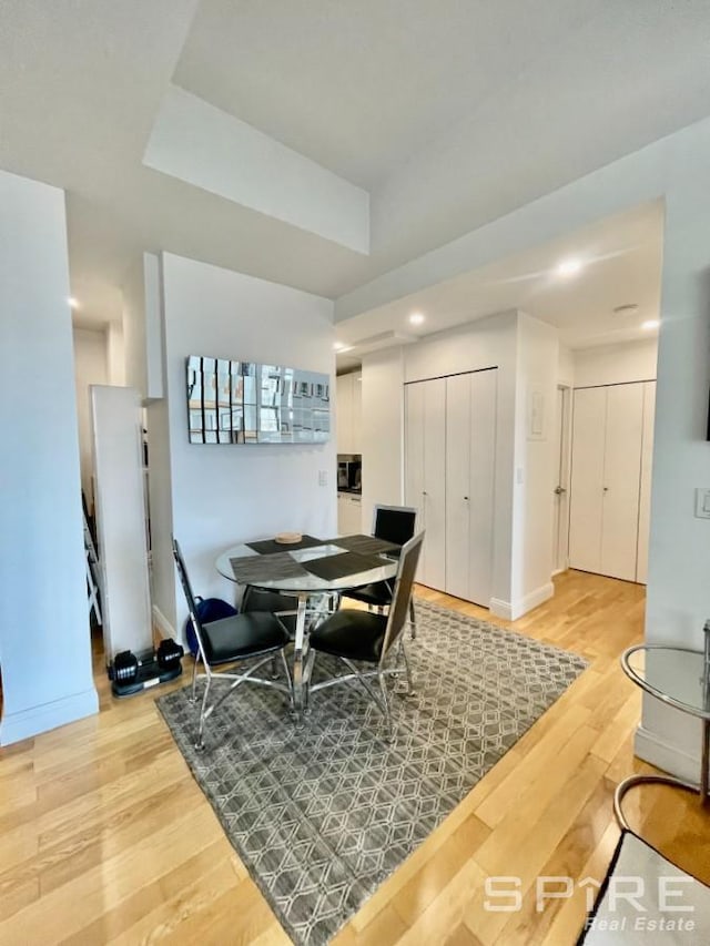 99 John St Unit 2201, New York City, NY 10038 - dining space featuring light wood-style flooring and recessed lighting