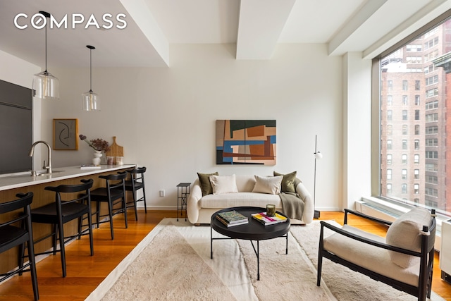 76 Madison Ave Unit 8C, New York City, NY 10016 - living area featuring wood finished floors and healthy amount of natural light