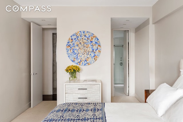 58 W 58th St Unit 19A, New York City, NY 10019 - bedroom with carpet floors and ensuite bathroom
