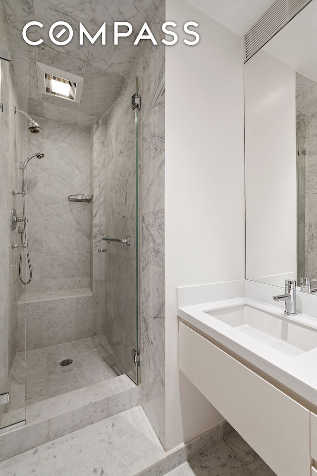 58 W 58th St Unit 19A, New York City, NY 10019 - full bath with vanity and a shower stall