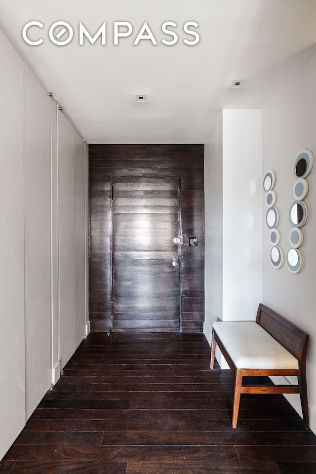 58 W 58th St Unit 19A, New York City, NY 10019 - hall featuring wood-type flooring