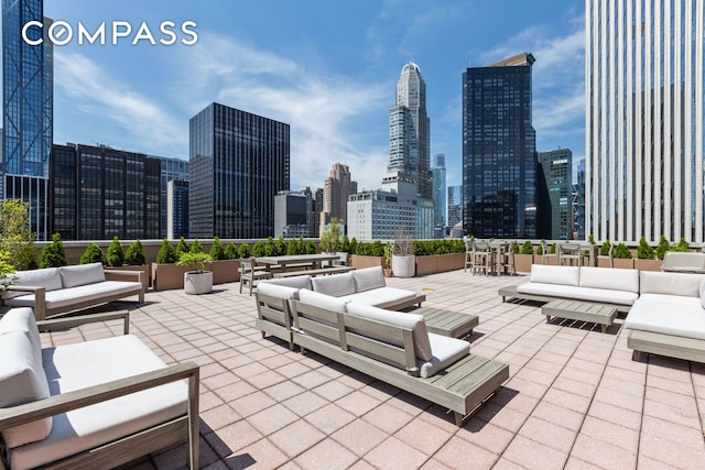 58 W 58th St Unit 19A, New York City, NY 10019 - view of patio with outdoor lounge area and a skyline view