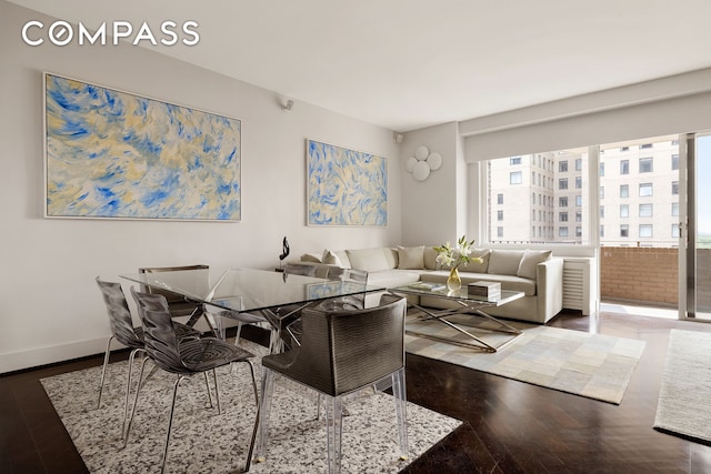 58 W 58th St Unit 19A, New York City, NY 10019 - living room with wood finished floors and baseboards