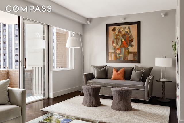 58 W 58th St Unit 19A, New York City, NY 10019 - living area with wood finished floors and baseboards
