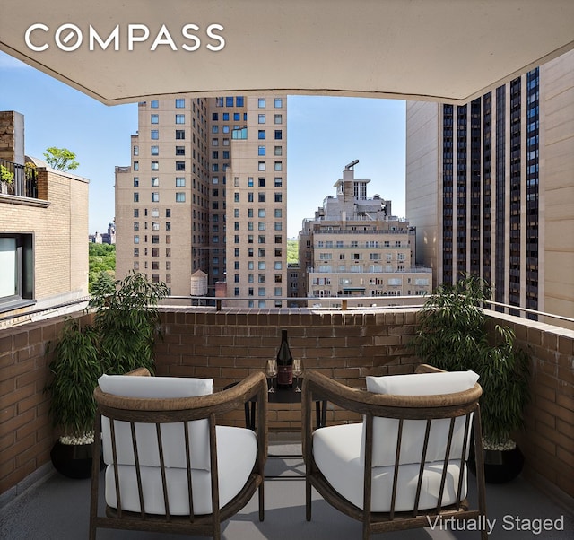 58 W 58th St Unit 19A, New York City, NY 10019 - balcony featuring a view of city