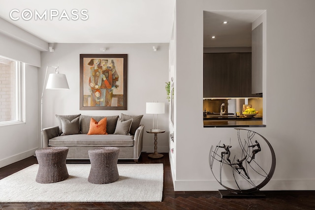 58 W 58th St Unit 19A, New York City, NY 10019 - living area with dark wood-style floors and recessed lighting