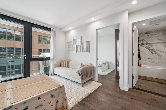 41-14 27th St Unit 8-B, New York City, NY 11101 - bedroom with dark wood-style floors, recessed lighting, access to outside, and ensuite bath