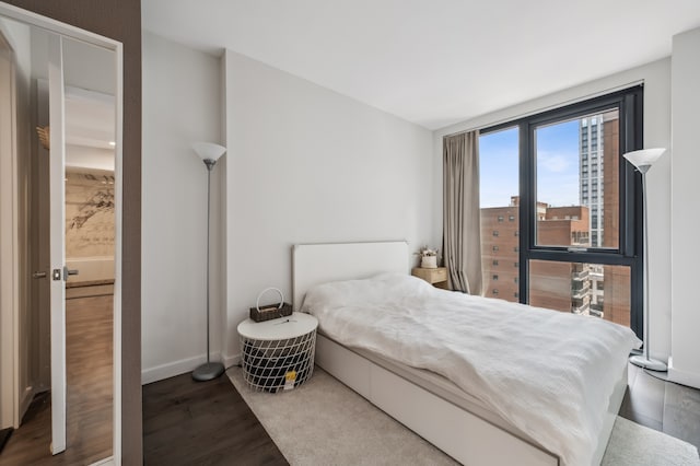 41-14 27th St Unit 8-B, New York City, NY 11101 - bedroom featuring wood finished floors and baseboards
