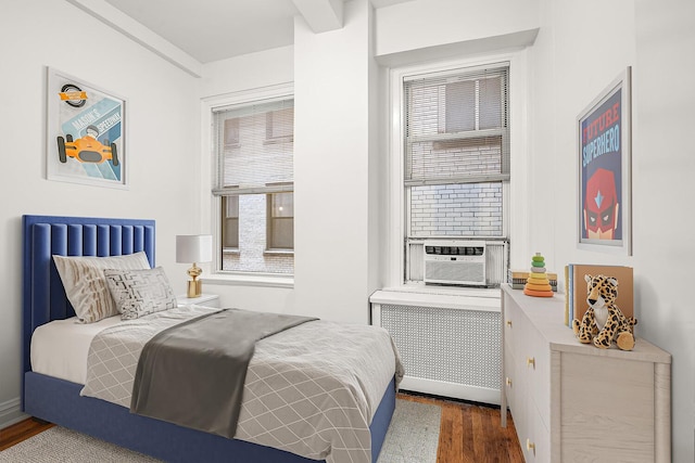 66 Madison Ave Unit 2De, New York City, NY 10016 - bedroom with radiator heating unit, wood finished floors, and cooling unit