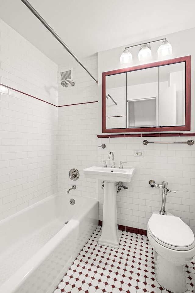 66 Madison Ave Unit 2De, New York City, NY 10016 - full bath featuring bathing tub / shower combination, tile patterned flooring, and tile walls