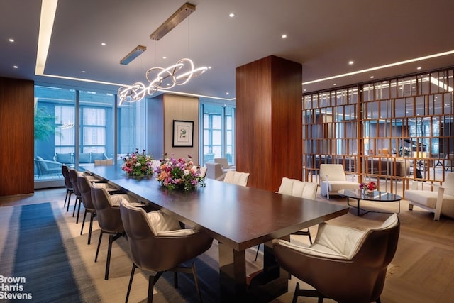 200 Amsterdam Ave Unit 32B, New York City, NY 10023 - dining space featuring a chandelier, a wall of windows, plenty of natural light, and recessed lighting