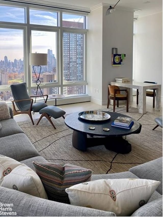 200 Amsterdam Ave Unit 32B, New York City, NY 10023 - living room featuring crown molding, floor to ceiling windows, and a view of skyline