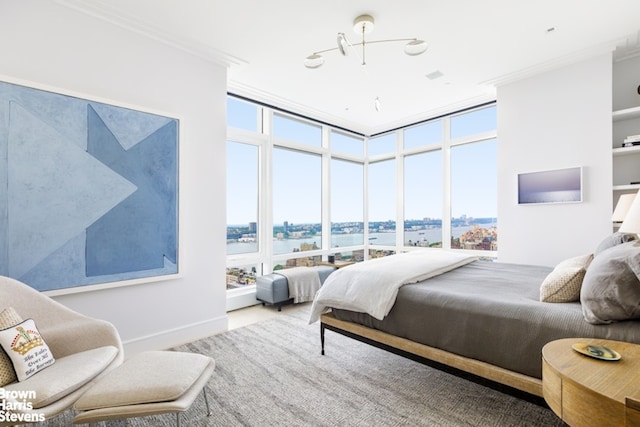 200 Amsterdam Ave Unit 32B, New York City, NY 10023 - bedroom featuring expansive windows, ornamental molding, and a water view