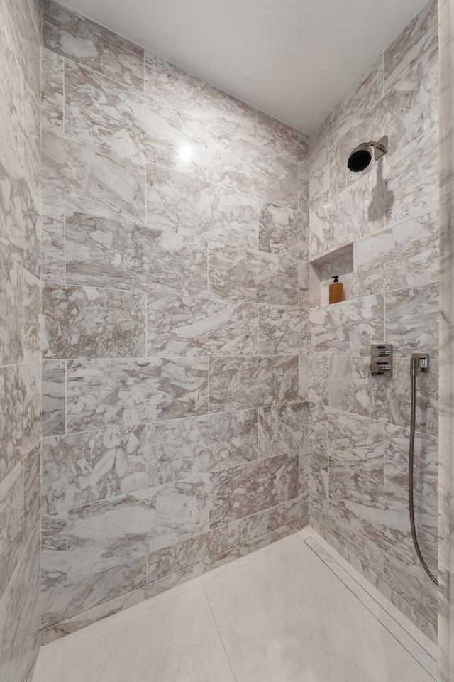 138 E 50th St Unit 26A, New York City, NY 10022 - bathroom featuring tiled shower