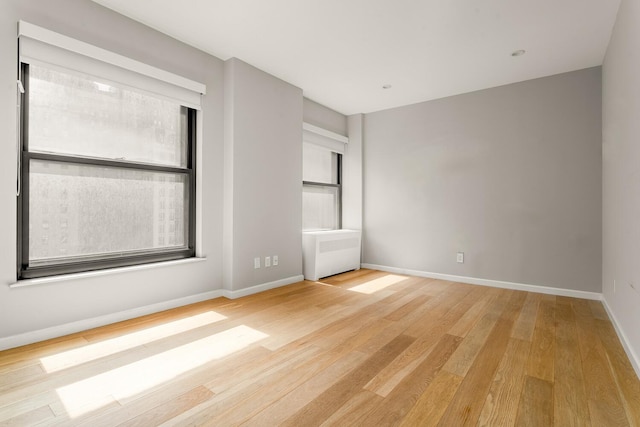 20 W St Unit 18F, New York City, NY 10004 - unfurnished bedroom featuring wood finished floors and baseboards