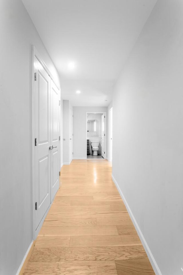 20 W St Unit 18F, New York City, NY 10004 - hallway with light wood-type flooring and recessed lighting