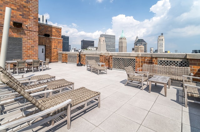 20 W St Unit 18F, New York City, NY 10004 - view of patio / terrace with a view of skyline and outdoor lounge area