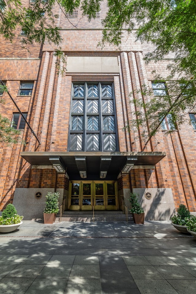 20 W St Unit 18F, New York City, NY 10004 - doorway to property featuring brick siding