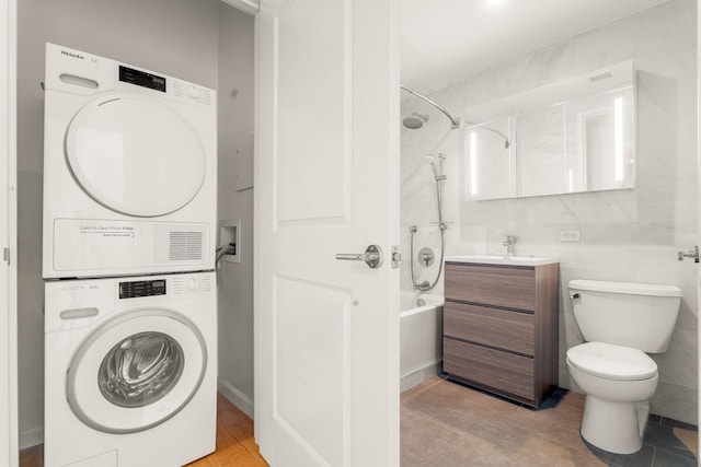 20 W St Unit 18F, New York City, NY 10004 - laundry area with stacked washer and clothes dryer