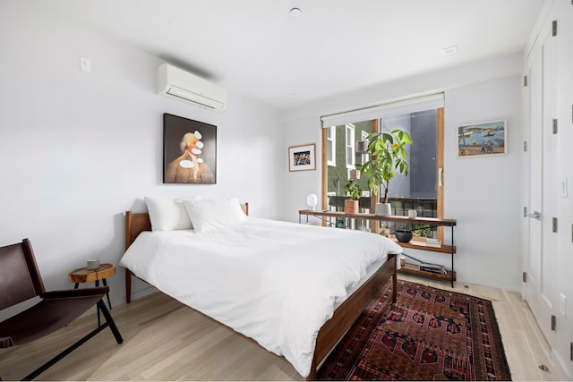 210 Jackson St Unit 2, New York City, NY 11211 - bedroom with an AC wall unit and light wood finished floors