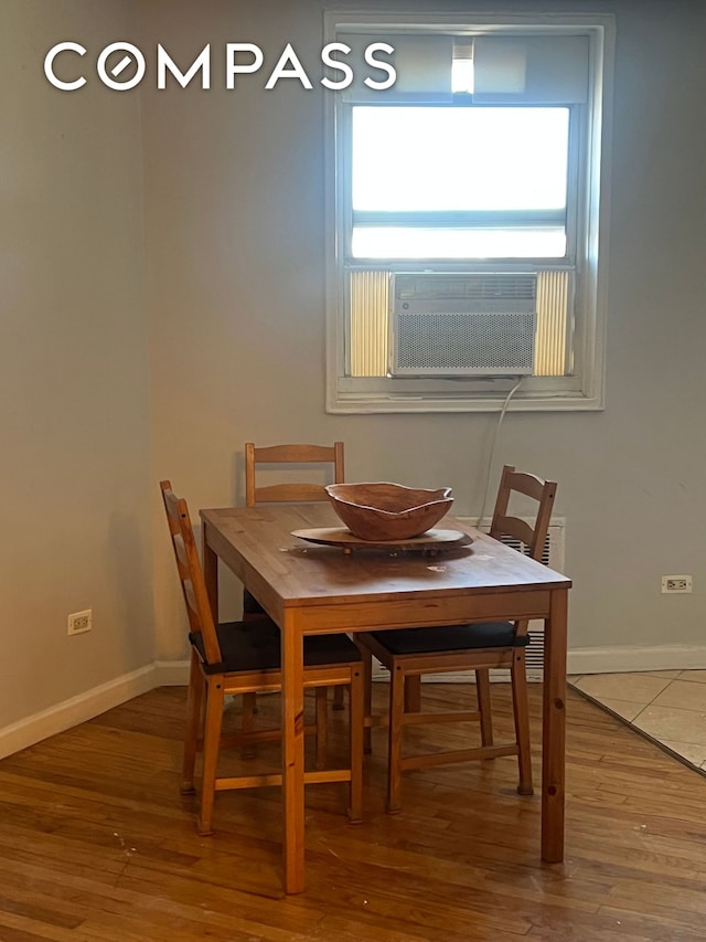 2035 E 7th St Unit 6B, New York City, NY 11223 - dining space with wood finished floors and cooling unit