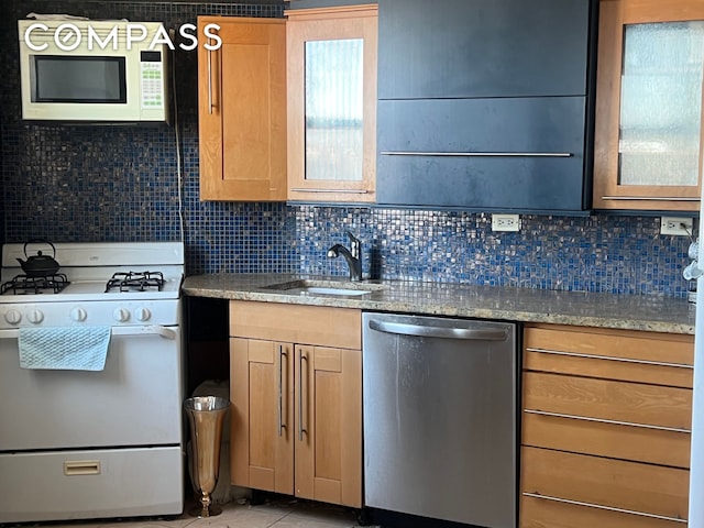 2035 E 7th St Unit 6B, New York City, NY 11223 - kitchen featuring white appliances, backsplash, glass insert cabinets, and light tile patterned floors