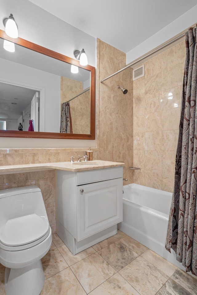 10 Little W St Unit 18-E, New York City, NY 10004 - bathroom with shower / tub combo with curtain, vanity, and tile walls