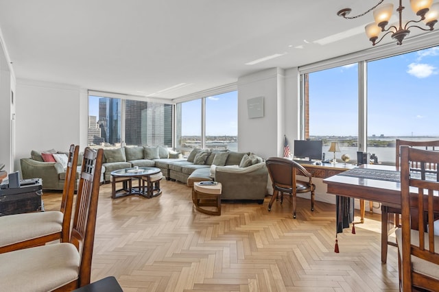 10 Little W St Unit 18-E, New York City, NY 10004 - living area featuring a chandelier, a wall of windows, healthy amount of natural light, and an office area