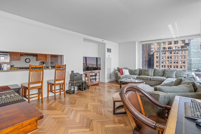 10 Little W St Unit 18-E, New York City, NY 10004 - living room featuring crown molding