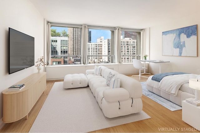 330 E 33rd St Unit 8F, New York City, NY 10016 - living room with wood finished floors and a view of city