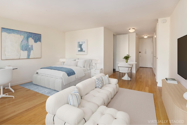 330 E 33rd St Unit 8F, New York City, NY 10016 - bedroom with light wood-type flooring and baseboards