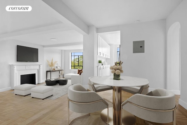 100 Riverside Dr Unit 7B, New York City, NY 10024 - dining area featuring electric panel, a fireplace, and arched walkways