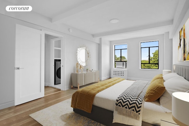 100 Riverside Dr Unit 7B, New York City, NY 10024 - bedroom with wood finished floors, washer / clothes dryer, beamed ceiling, and cooling unit