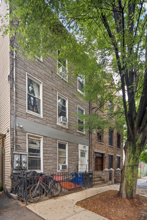 130 Coffey Street House, New York City, NY 11231 - view of property featuring a fenced front yard and cooling unit