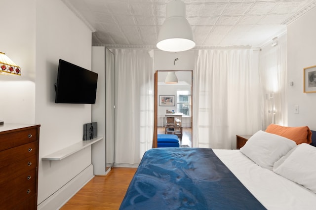 130 Coffey Street House, New York City, NY 11231 - bedroom with light wood finished floors and an ornate ceiling