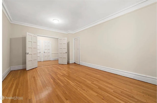 118 W 79th St Unit 9B, New York City, NY 10024 - unfurnished bedroom with light wood-style floors and ornamental molding