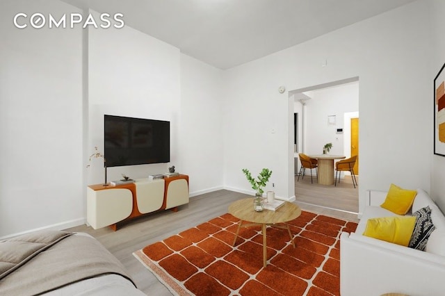 312 W 49th St Unit 1Rw, New York City, NY 10019 - living area featuring wood finished floors and baseboards