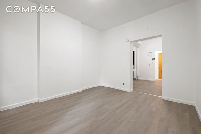 312 W 49th St Unit 1Rw, New York City, NY 10019 - empty room with wood finished floors and baseboards
