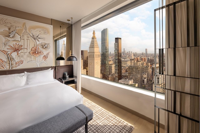 25 W 28th St Unit Ph40C, New York City, NY 10001 - bedroom with wood finished floors and a skyline view