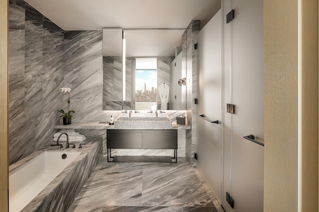 25 W 28th St Unit Ph40C, New York City, NY 10001 - full bathroom featuring a bath, vanity, and marble tiled flooring