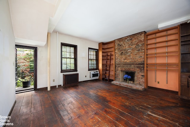 47 King St Unit 2, New York City, NY 10014 - unfurnished living room featuring hardwood / wood-style floors and a brick fireplace
