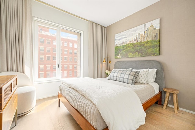 345 W 14th St Unit 5A, New York City, NY 10014 - bedroom featuring light wood-style floors and multiple windows