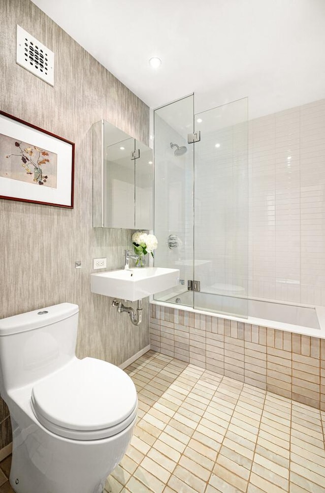 345 W 14th St Unit 5A, New York City, NY 10014 - full bathroom featuring tiled shower / bath and tile patterned floors