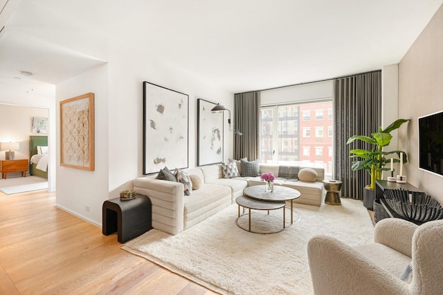 345 W 14th St Unit 5A, New York City, NY 10014 - living room featuring wood finished floors and baseboards