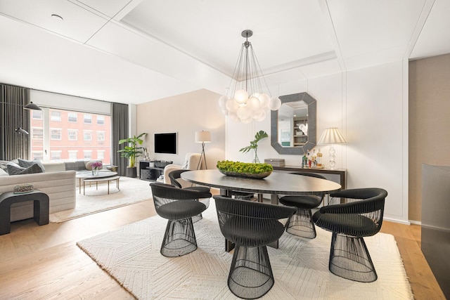 345 W 14th St Unit 5A, New York City, NY 10014 - dining space with wood finished floors and a chandelier